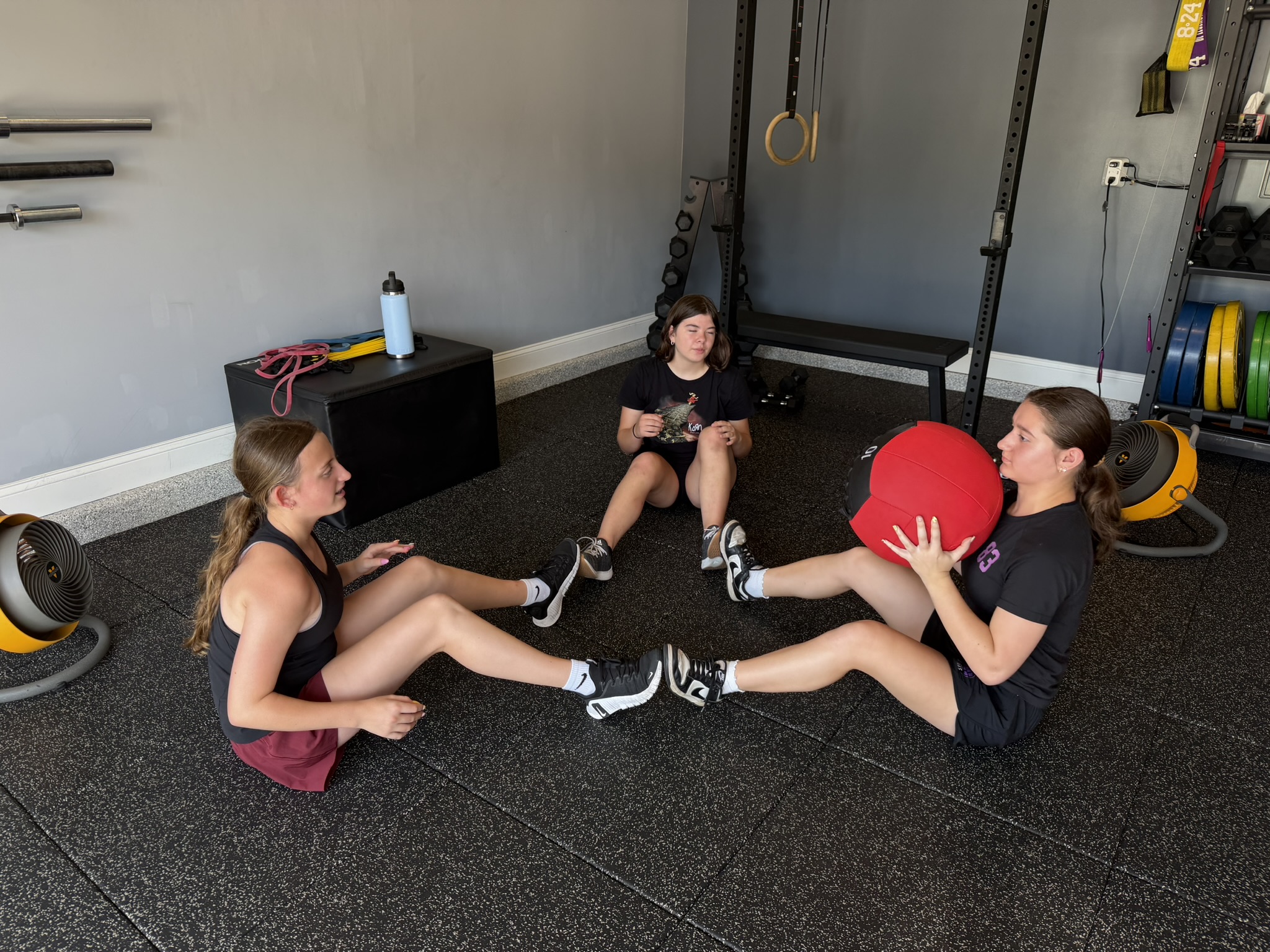 Small group training session with medicine ball